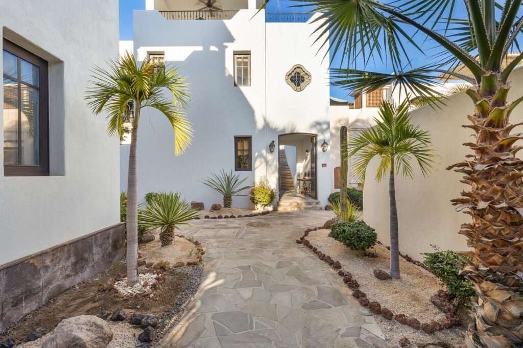 Loreto Agua Viva Experience the perfect blend of luxury and comfort at AV 64. This stunning 2-bedroom, 2 bathroom Bohemia residence features generous outdoor space and stylish interiors, making it an ideal retreat for both relaxation and entertainment. On the ground level of this elegant home is a spacious hardscaped inner courtyard with a built in BBQ area, a walk in storage closet, kitchen, living and dining area and a beautiful en-suite. The ground floor of AV 64 features an open-concept layout, with a cozy living room that flows into the dining area and kitchen. French doors allow natural light to flood the interior spaces, seamlessly connecting the outdoor and indoor living areas. Additionally, there is a back entrance for convenient access to the community pool and quiet neighborhood garden. The second floor of AV 64 features a lovely terrace with added privacy walls, and a second BBQ area. The terrace overlooks the serene community garden. A cozy en-suite with double vanities complete the second floor of this gorgeous residence.Enjoy fantastic Sierra Gigante – Avenida Agua Tranquila, Loreto, BS