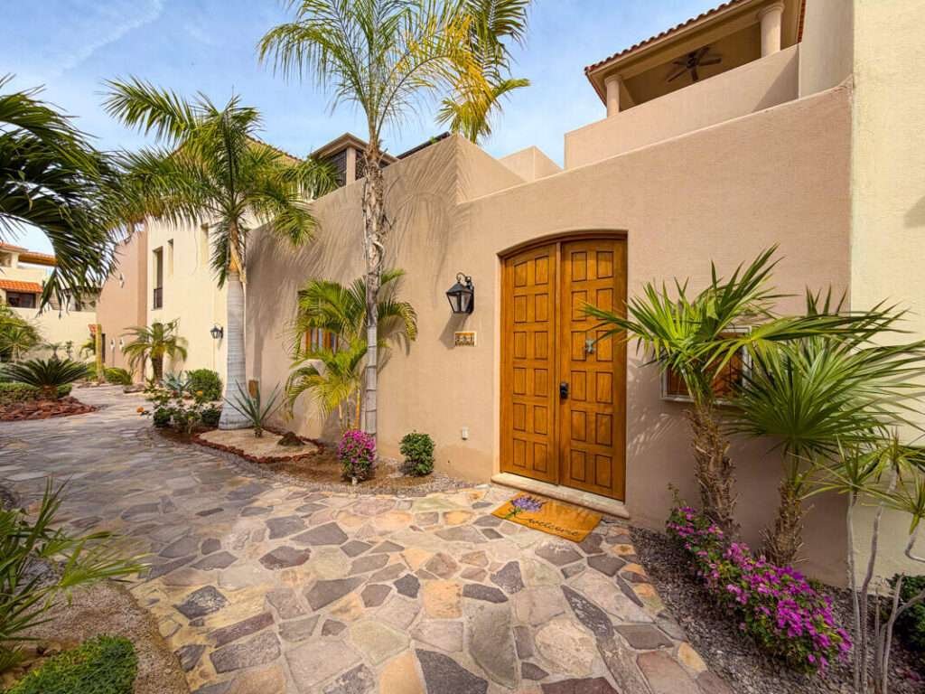 Loreto Agua Viva Introducing AV 231, an extraordinary corner residence featuring a side yard and stunning vistas of the Sea of Cortez, golf course, and nearby islands. This delightful Nueva Chica home is in impeccable condition, exuding warmth and brightness. The main level showcases an open-concept living and kitchen area that seamlessly transitions into a private garden. The kitchen boasts a generous pantry, upgraded neutral granite countertops, stainless steel appliances, a secondary water heater, and an under-sink water purification system. The serene garden retreat is equipped with two gated entrances and offers ample space for bicycles, sports gear, and even pets. Just outside the back gate, you'll discover a charming flagstone veranda that overlooks a beautifully landscaped community courtyard. Completing the ground level is a lovely primary en-suite bathroom featuring dual sinks.Ascend to the second-level terrace, a perfect space for unwinding and entertaining, complete with a built-in BBQ area and breathtaking – Avenida Punta Arenas, Loreto, BS