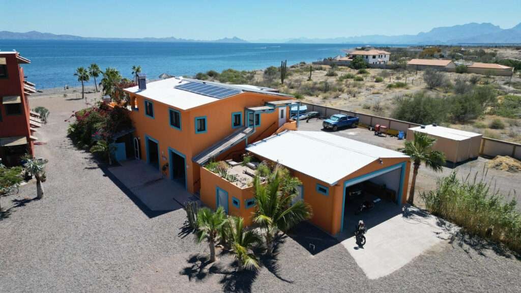 Loreto General This property is a beautifully designed duplex with two independent homes on a generous 1,389 m2 lot. Each unit features a spacious bedroom, a large bathroom, a fully equipped kitchen, and a comfortable living and dining area with quality furnishings, Wi-Fi, and elegant lighting. The downstairs unit includes an additional powder room, enhanced window security, and a stunning hand-painted mosaic mural, fire pit, and landscaped garden.The upstairs unit mirrors the layout and amenities and offers a large ocean- – Casa Orca, Loreto, Loreto, BS