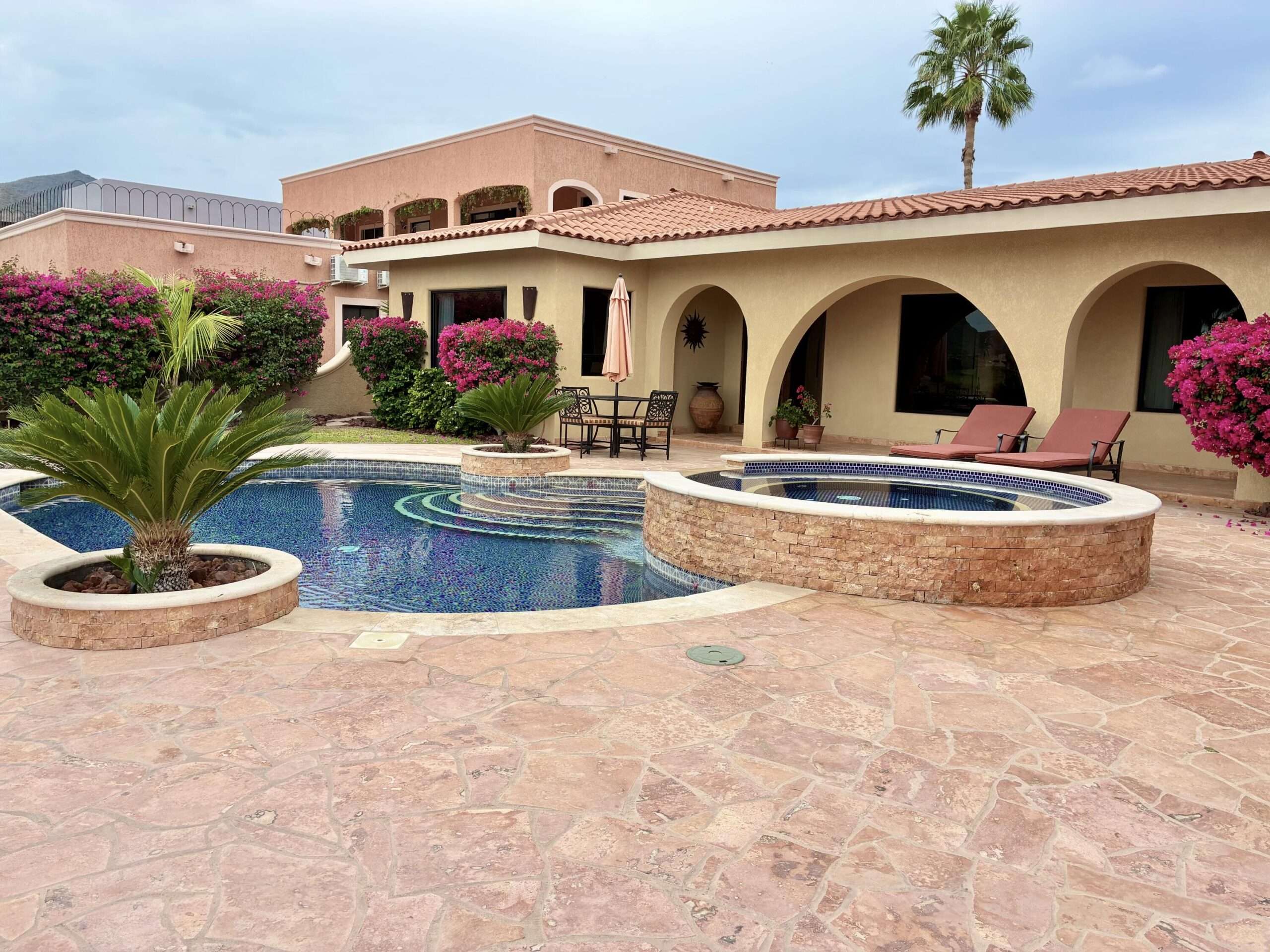 Loreto General Casa Flores is a truly unique golf course residence located in the sought-after Cul De Sac of Returno Mission San Javier in Nopolo. This beautiful single-story home features 2 bedrooms and 3 bathrooms, offering breathtaking for sale