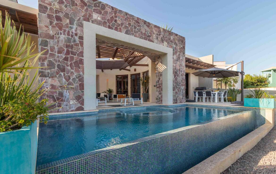 Loreto Founders Experience luxury living on the 17th hole of the Loreto Bay Golf Course in this custom 4-bedroom, 5-bath masterpiece by acclaimed Beverly Hills architects Shubin and Donaldson. Enter through resin and wood French doors into a grand circular foyer framing stunning golf course for sale