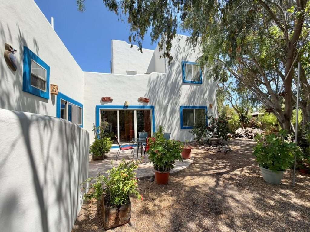 Loreto Centro Casa Isla Danzante — Charming 3BR Home on a Large Lot with established garden and covered boat parking in Historic LoretoWelcome to Casa Isla Danzante, a delightful two-story home blending traditional Loreto character with modern comforts. Situated on a generous 10,570 sq ft double lot on a quiet street in the heart of historic Loreto, this 1,500 sq ft residence offers space, privacy, and excellent potential — room to park a boat under cover, grow a garden, or add a casita or workshop.Two bedrooms on the second level, each with its own entranceOpen flow between kitchen, dining and living ar Study/office nook and large pantry for extra storageFully updated kitchen and A/COutdoor Features & SystemsLarge covered parking area for boat/RV storageProtected garden area with rich soil and drip irrigationLush, mature landscaping with shade trees a haven for birds and lizardsUpstairs terraza with mountain – Founders 200, Loreto, Loreto, BS