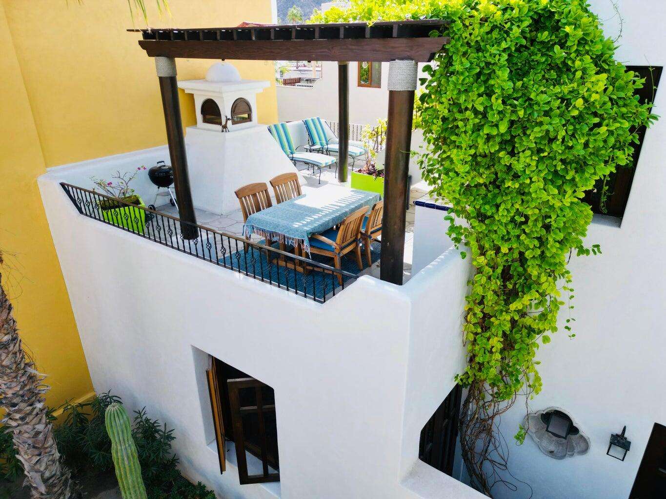 Loreto Agua Viva Welcome to AV43, a bright two-bedroom, two-bath Nueva Chica home in the Agua Viva neighborhood, just steps from shops and restaurants. The first floor features an open-concept living, dining, and kitchen area, plus a guest bedroom with ensuite bath for convenient single-level living. A charming courtyard connects the living spaces and leads to a second-level terrace with built-in grill and access to the primary suite. The third-level for sale